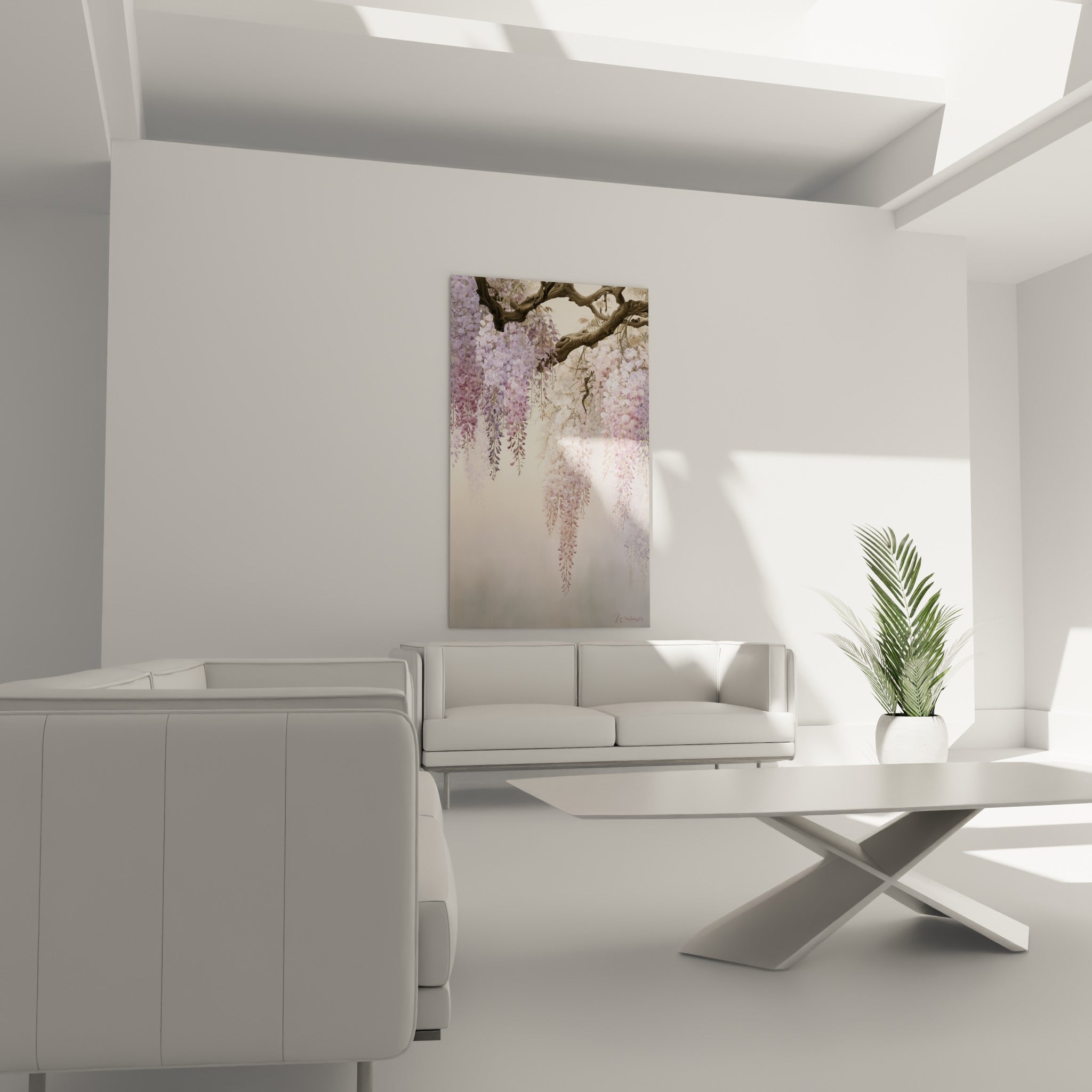 Fleurs de glycine pastel et branche brune positionnées au-dessus d'un canapé dans un salon lumineux