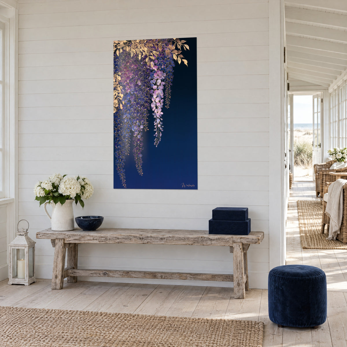 Wall art cascading wisteria flowers in lilac and indigo, chiselled gold leaves at the top, on a wall of white slats by the sea
