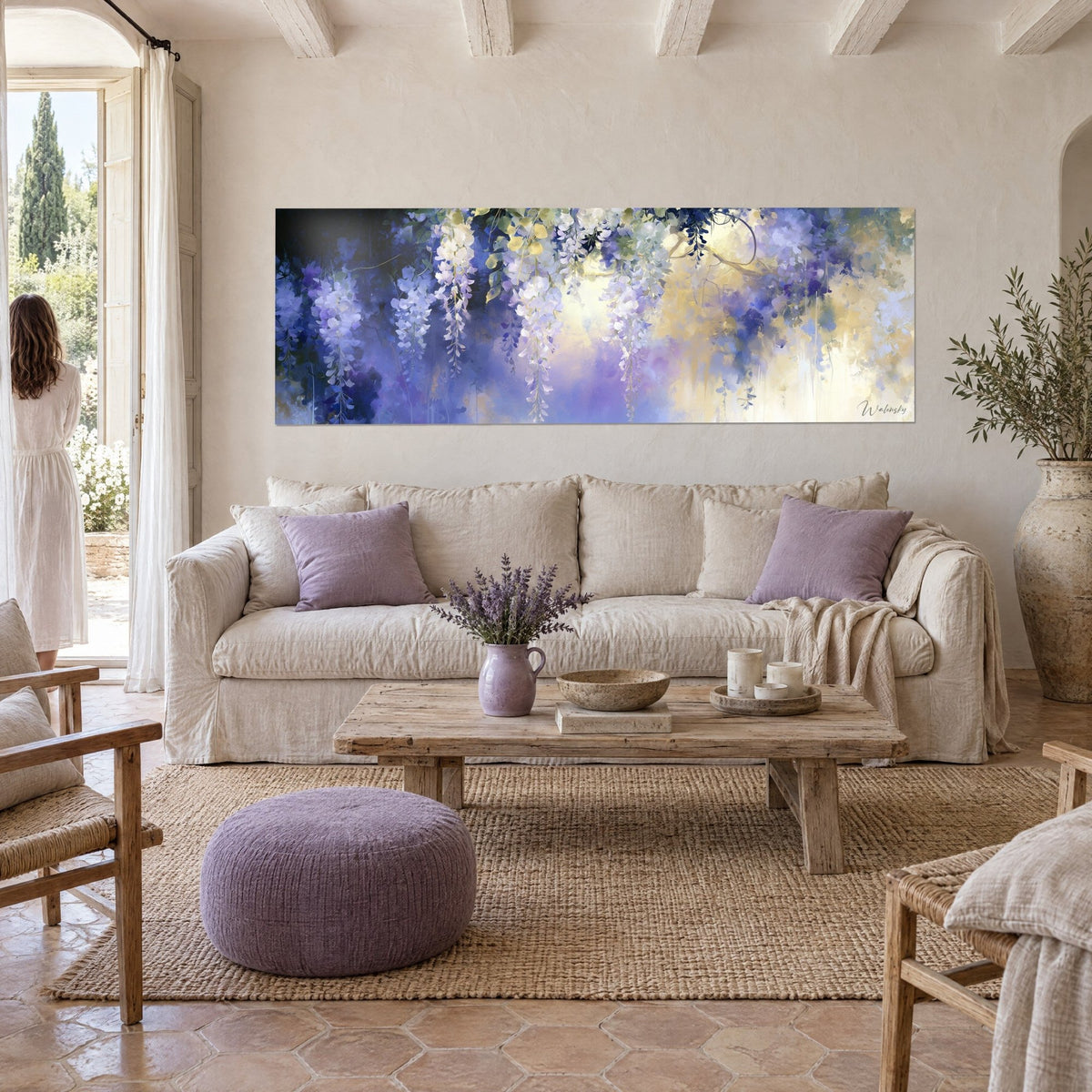 Wall art white wisteria cascading on an indigo background, golden glow at the centre, above a sofa in a bright living room