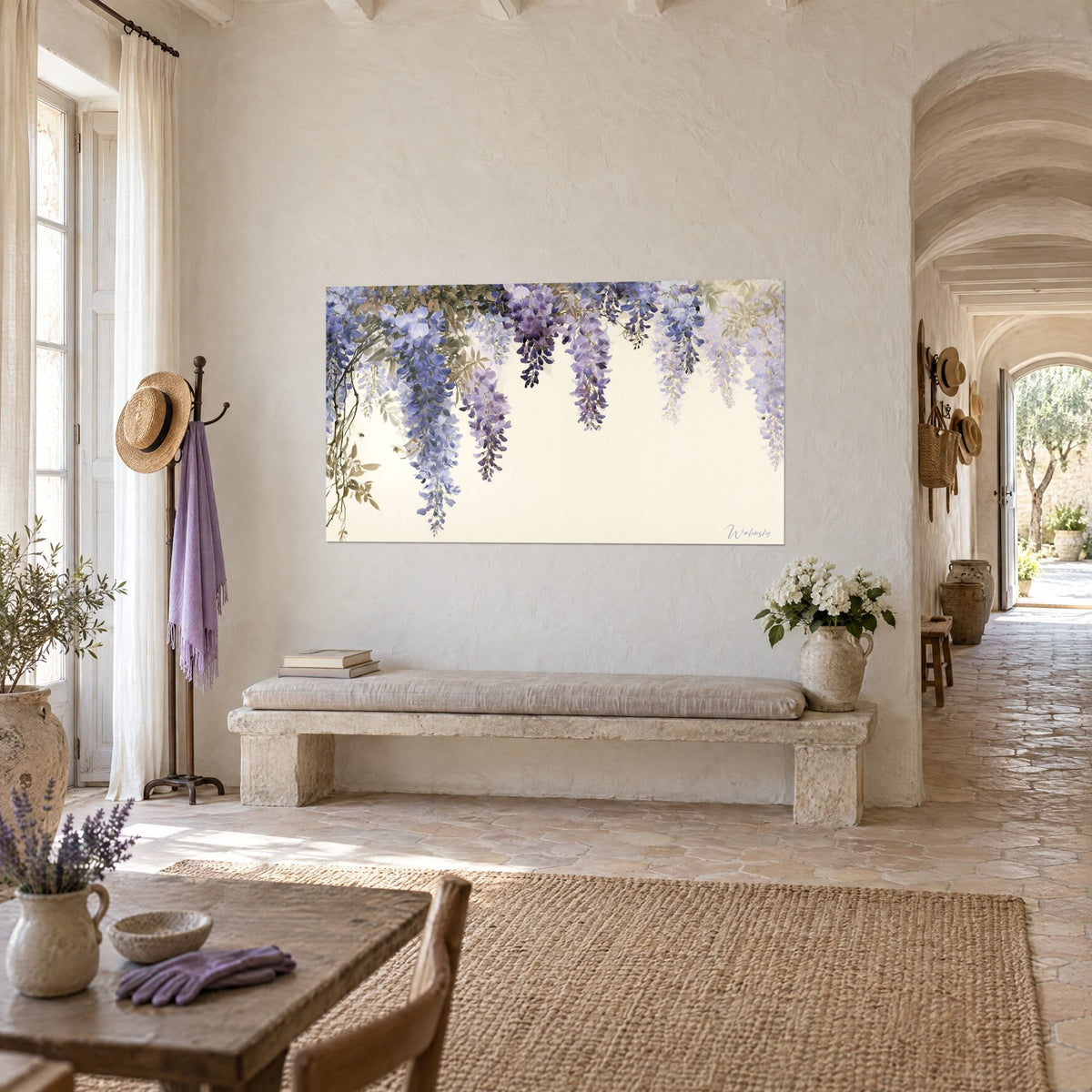 Wall art with cascading wisteria blooms in lavender and violet, olive foliage, hung in a vaulted corridor of a Provençal farmhouse