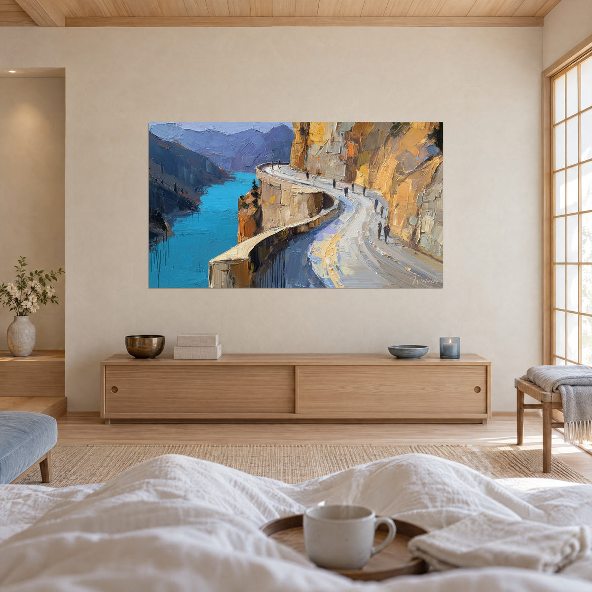 Tableau chemin des crêtes sur falaise orangée, rivière turquoise et reliefs bleutés, au-dessus d'un lit dans une chambre claire