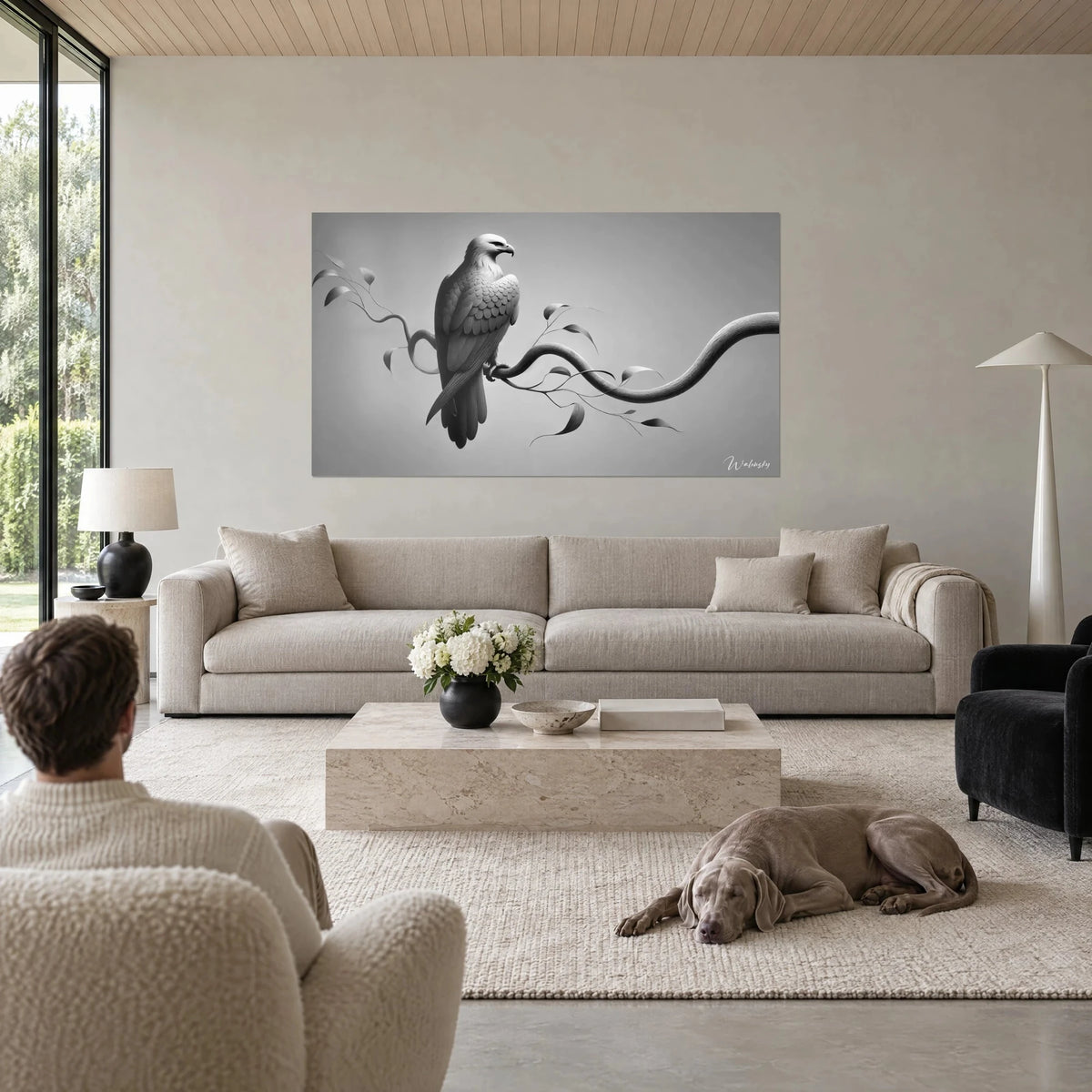 Wall art of a bird of prey perched on a winding branch, pearl grey and black plumage, fine leaves, above a sofa in a bright living room