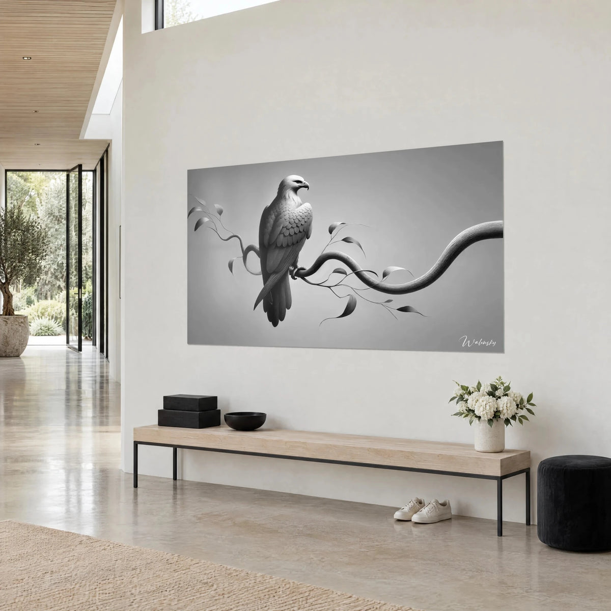 Wall art of an eagle sculpted in grey feather scales, wavy black and silver branch, seen three-quarter view on a white wall