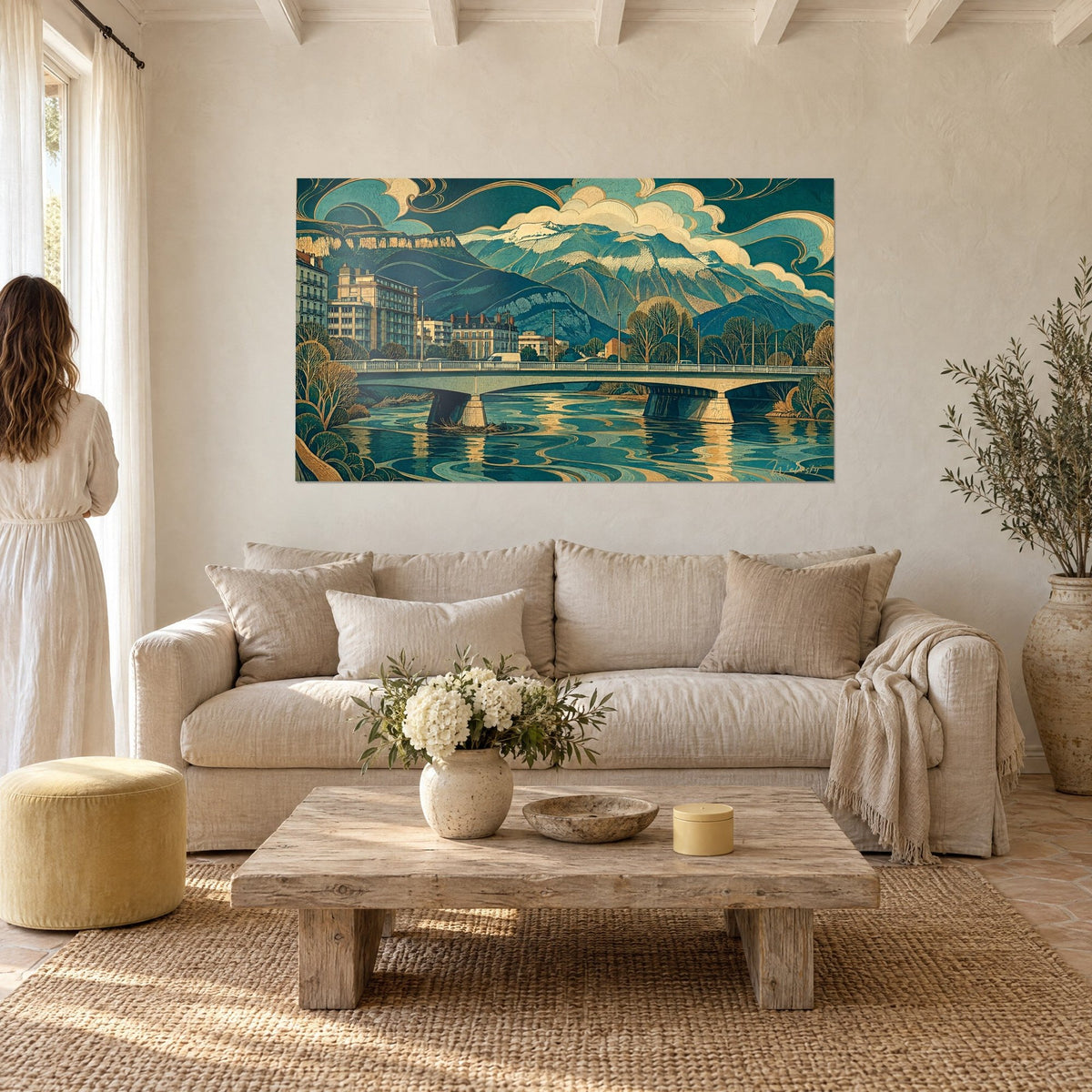 Wall art bridge over the Isère, grey arches and duck-egg blue water, ochre and cream snowy peaks, above a sofa in a bright living room