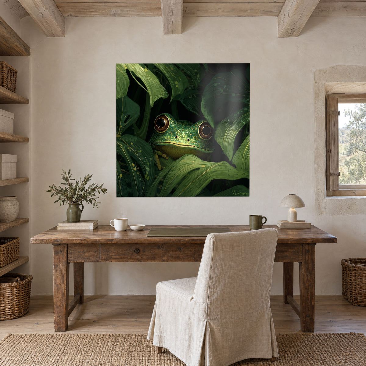 Wall art of a small green frog dotted with gold and glossy dark green foliage, hung above a raw wood desk