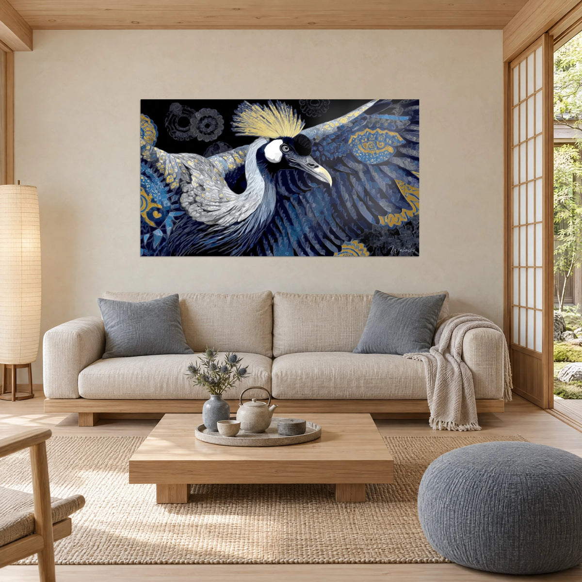 Wall art crowned crane with spread wings, midnight blue and gold plumage, golden crest, above a sofa in a bright living room