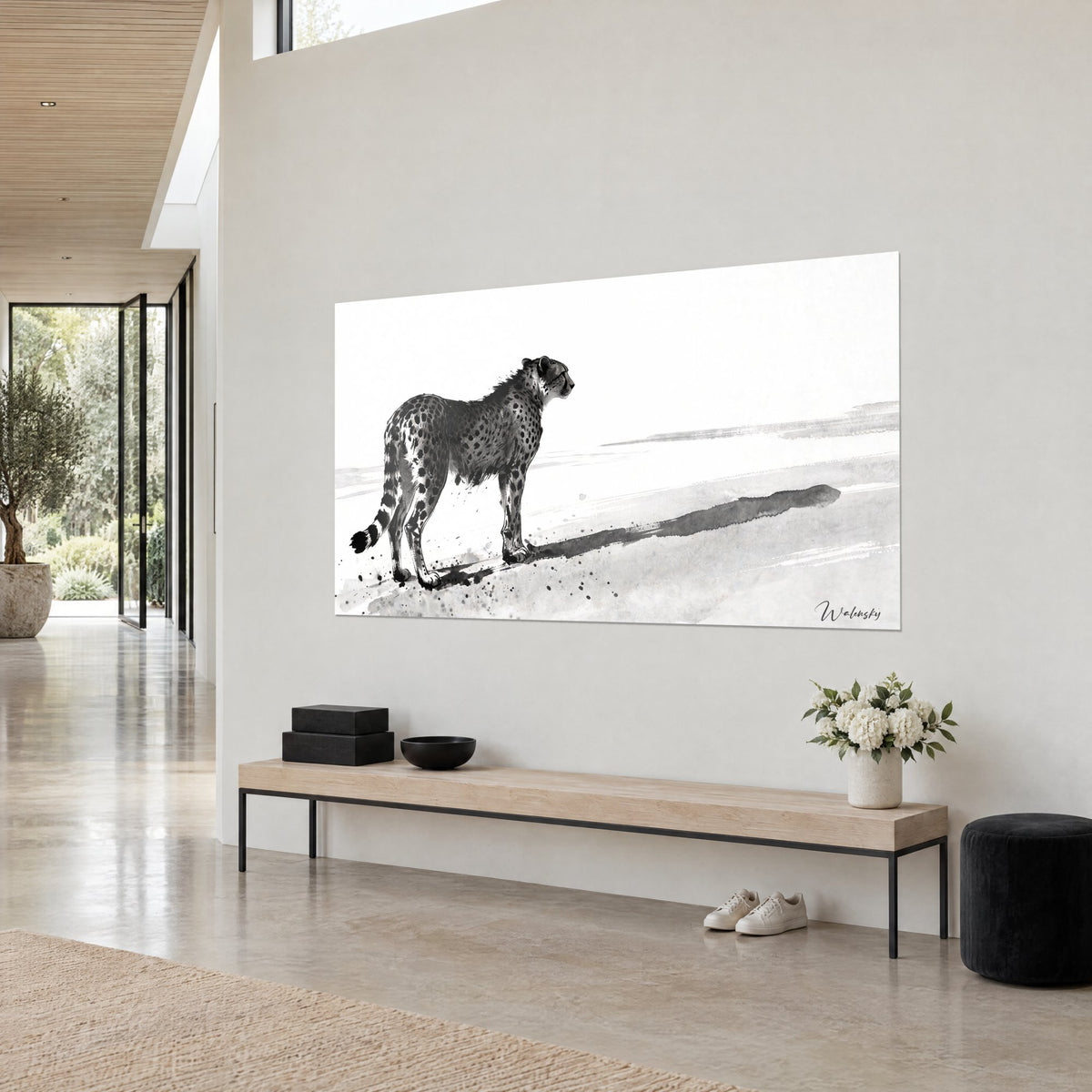 Wall art feline spotted in black and grey, splashes on the floor, three-quarter view on a light beige wall