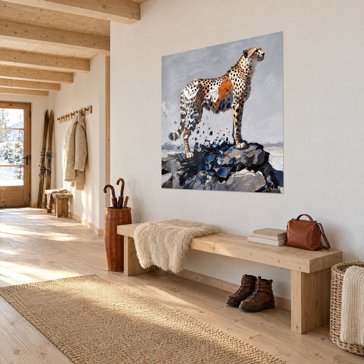 Wall art of a cheetah perched on a rock, ochre and orange coat fragmented into navy blue shards, white chalet entrance wall, three-quarter view