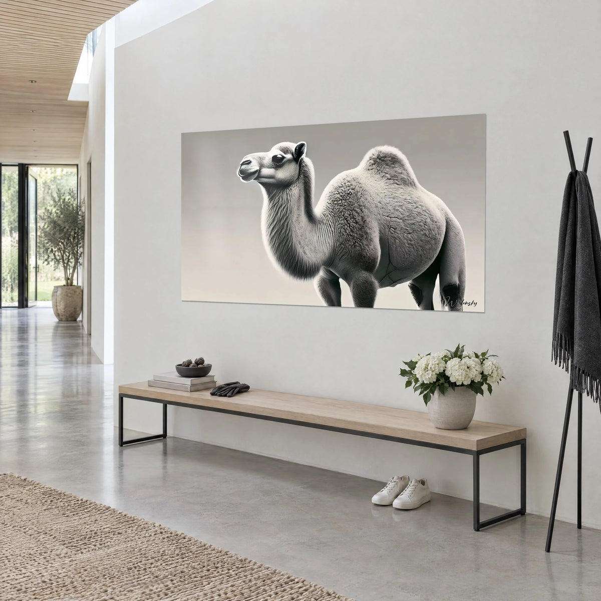 Wall art dromedary with fluffy grey fleece, muzzle turned left on a beige background, on a white wall of an airy entrance hall