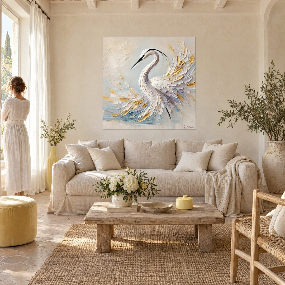 Wall art white heron with cream and golden feathers, S-shaped neck on a beige background, couple seen from behind above a sofa in a bright living room