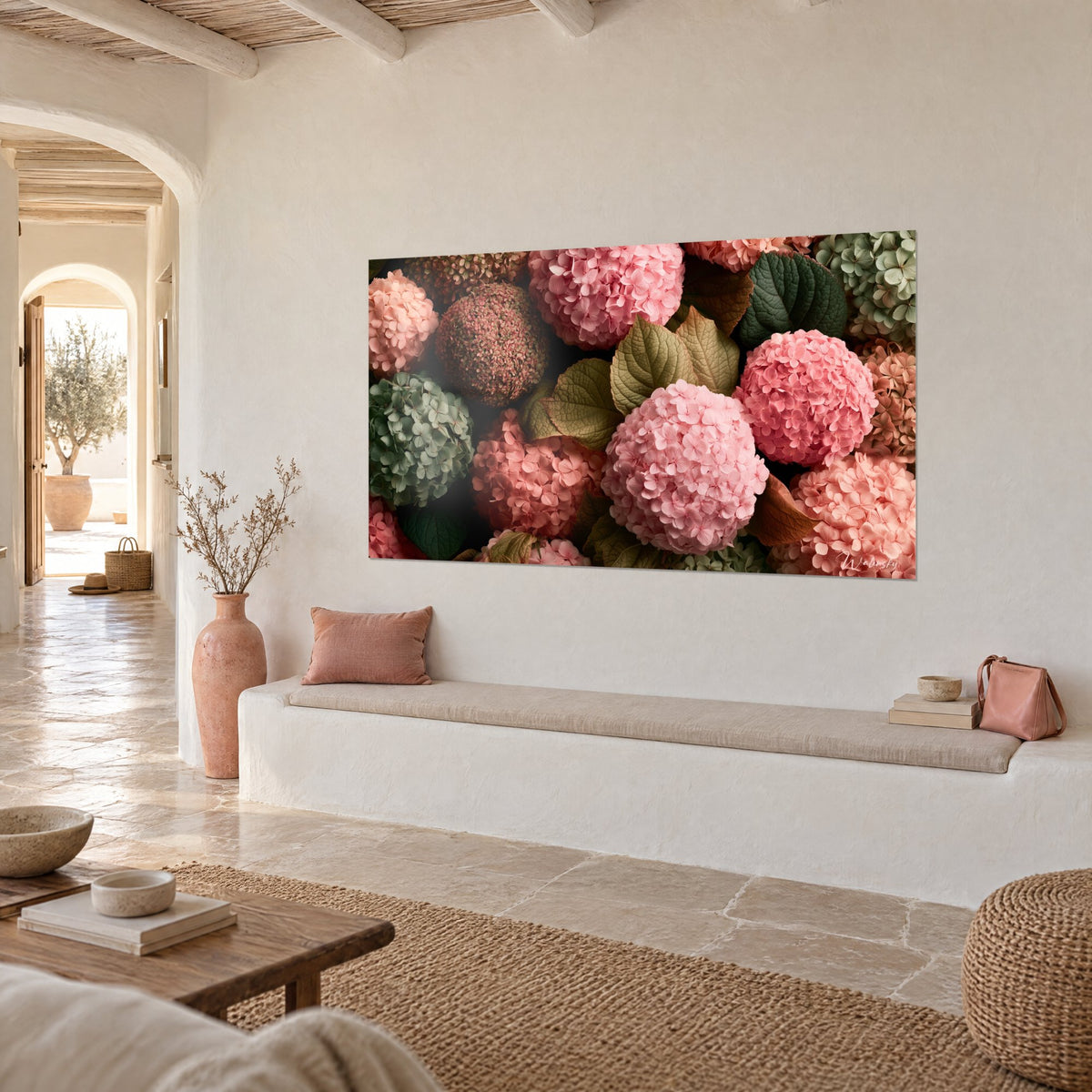 Wall art with balls of coral and bubblegum-pink petals among deep green foliage, on a lime-washed wall, Mediterranean house