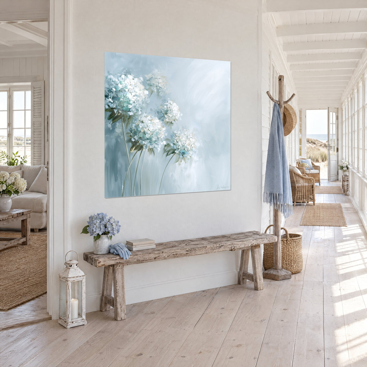 Wall art of a bouquet of pearly umbels with turquoise and ivory petals, slender stems on a blue-grey background, in the entrance hall of a seaside house