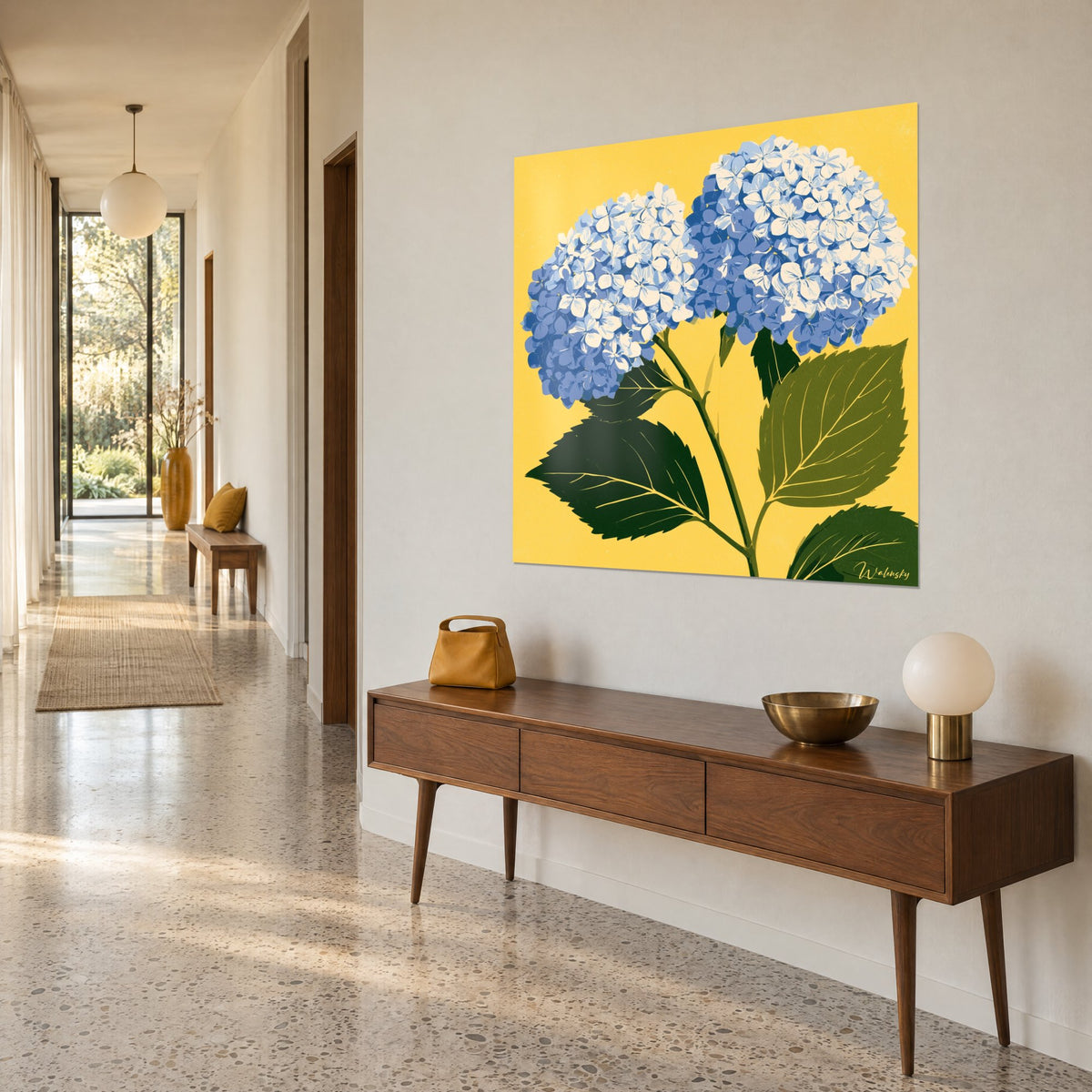 Wall art two cobalt blue and off-white umbels on a solid yellow background, serrated olive leaf, in a hallway beside a wooden console