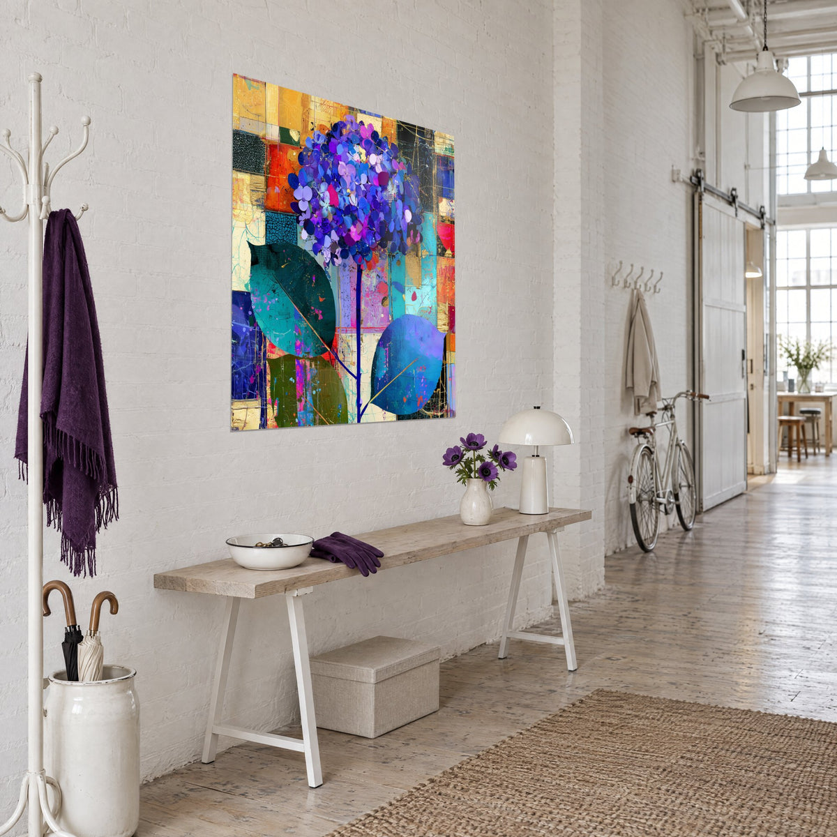 Wall art of a mauve and indigo flower bouquet, two large fir green and royal blue leaves, three-quarter view in a loft