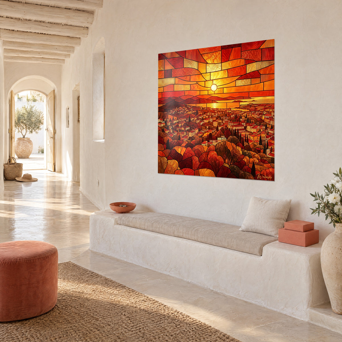 Collines et toits provençaux en orange flamboyant au-dessus d'un canapé dans un salon lumineux