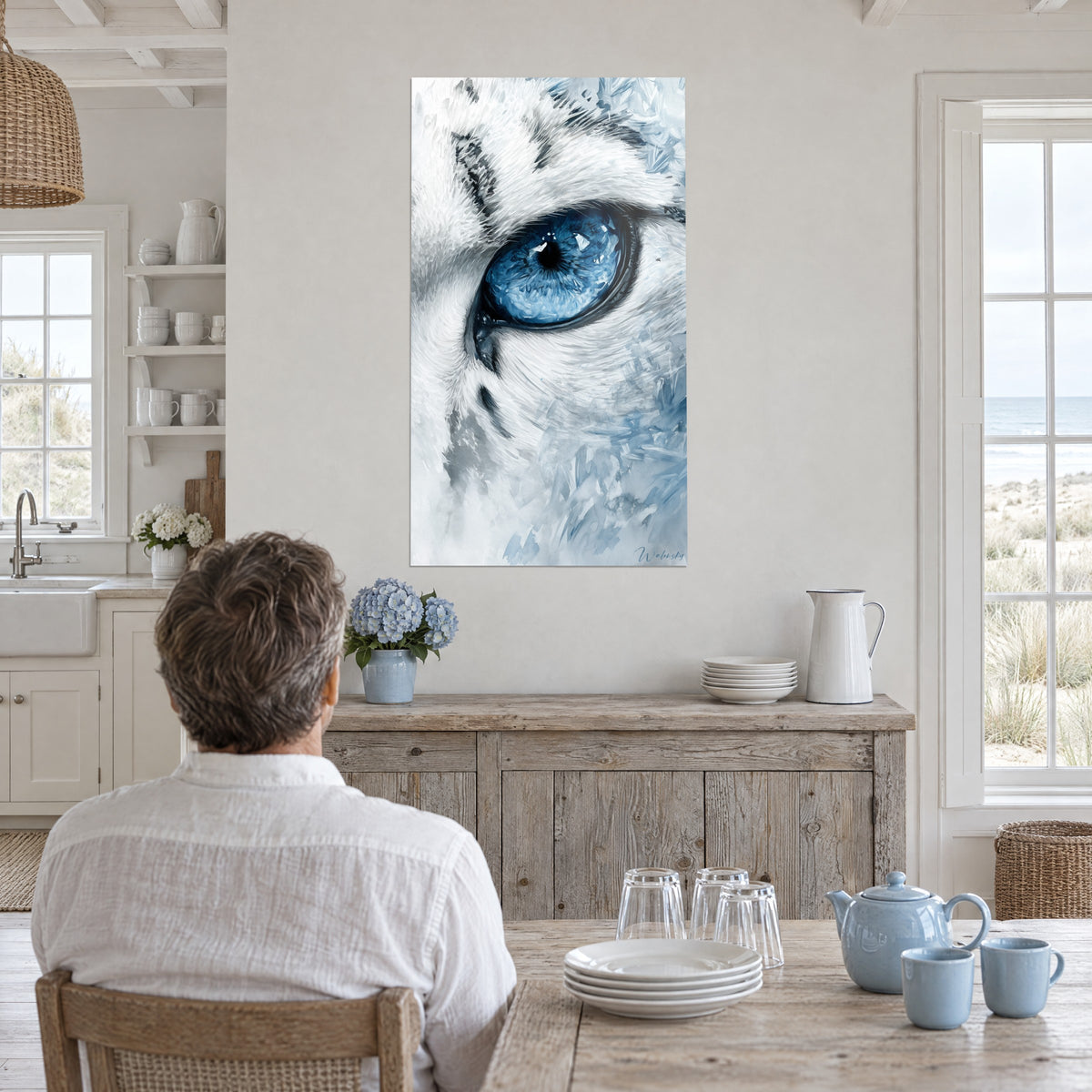 Wall art of a frosted iris of a white wolf, sky blue and pearl grey highlights, facing a weathered wooden table near a large window