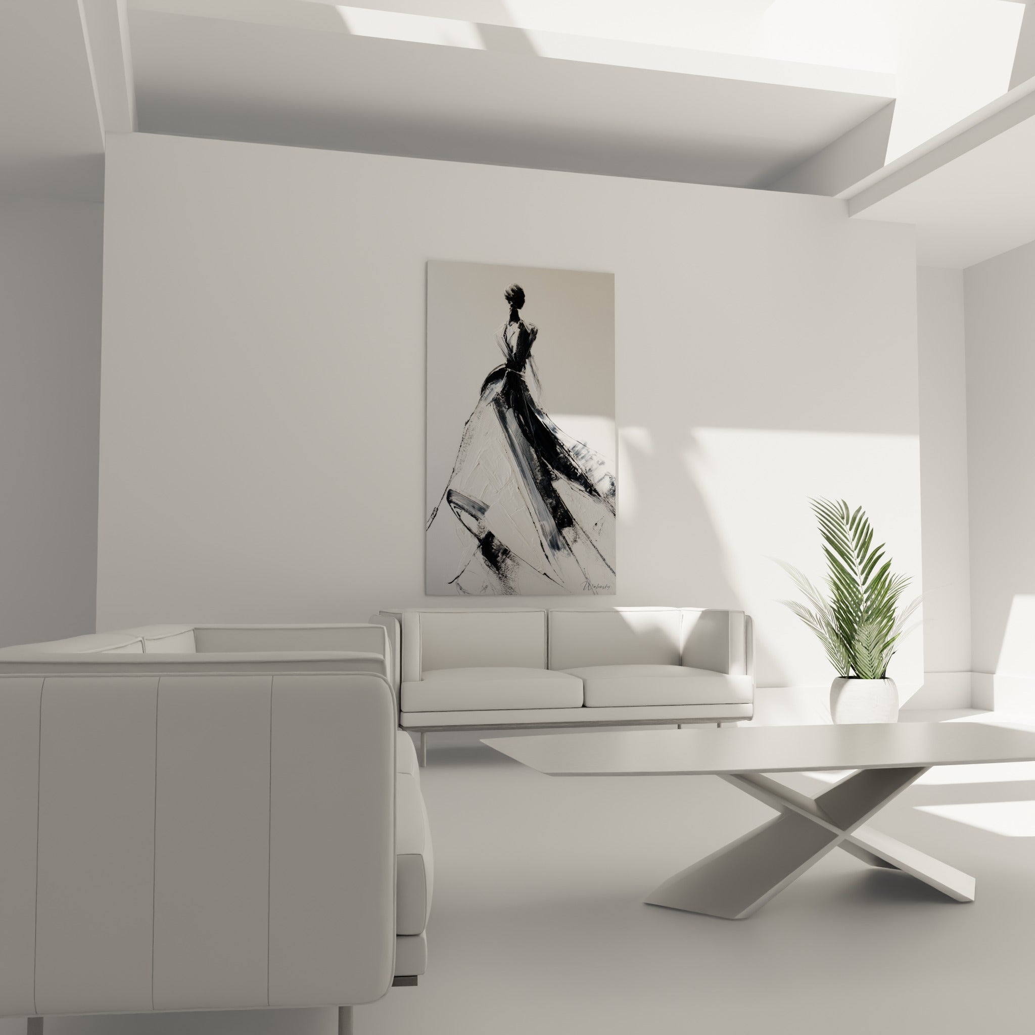 Figure en robe ample noir charbon et blanc nacré accrochée au-dessus d'un canapé dans un salon lumineux
