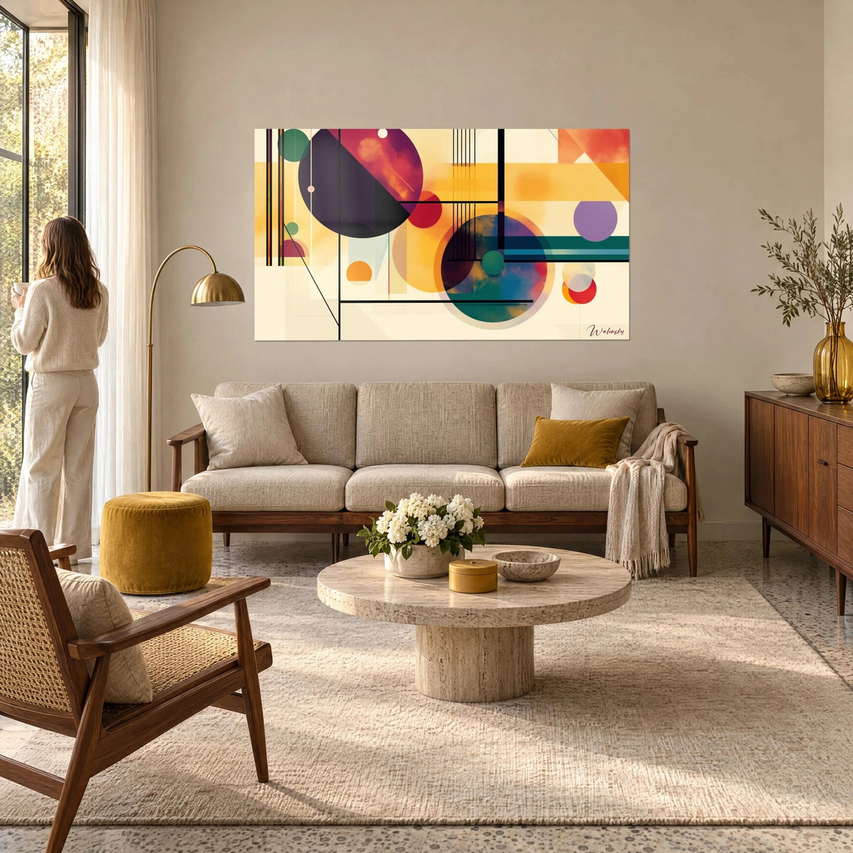 Wall art with plum and turquoise circles floating on a cream background, black lines and ochre fields, hanging above a sofa in a bright living room