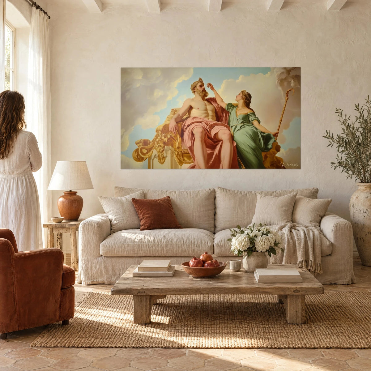 Wall art of Jupiter enthroned bare-chested, draped in pink, Thetis in a green gown touching his chin, above a sofa in a bright living room