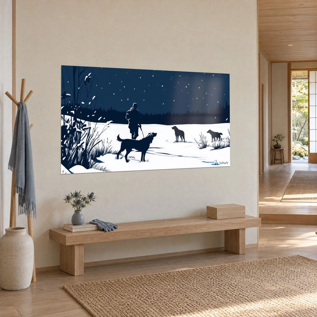 Wall art three black dogs on a snowy field, dark pines and midnight blue sky with snowflakes, hung in a japandi living room