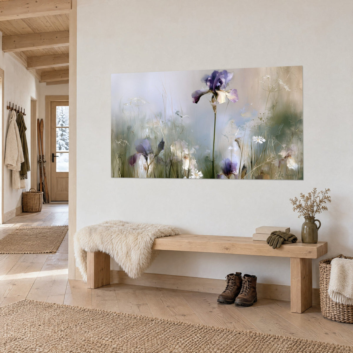 Wall art of a purple and ivory iris bloom in misty grass, sage green tones, above a wooden bench in a mountain chalet