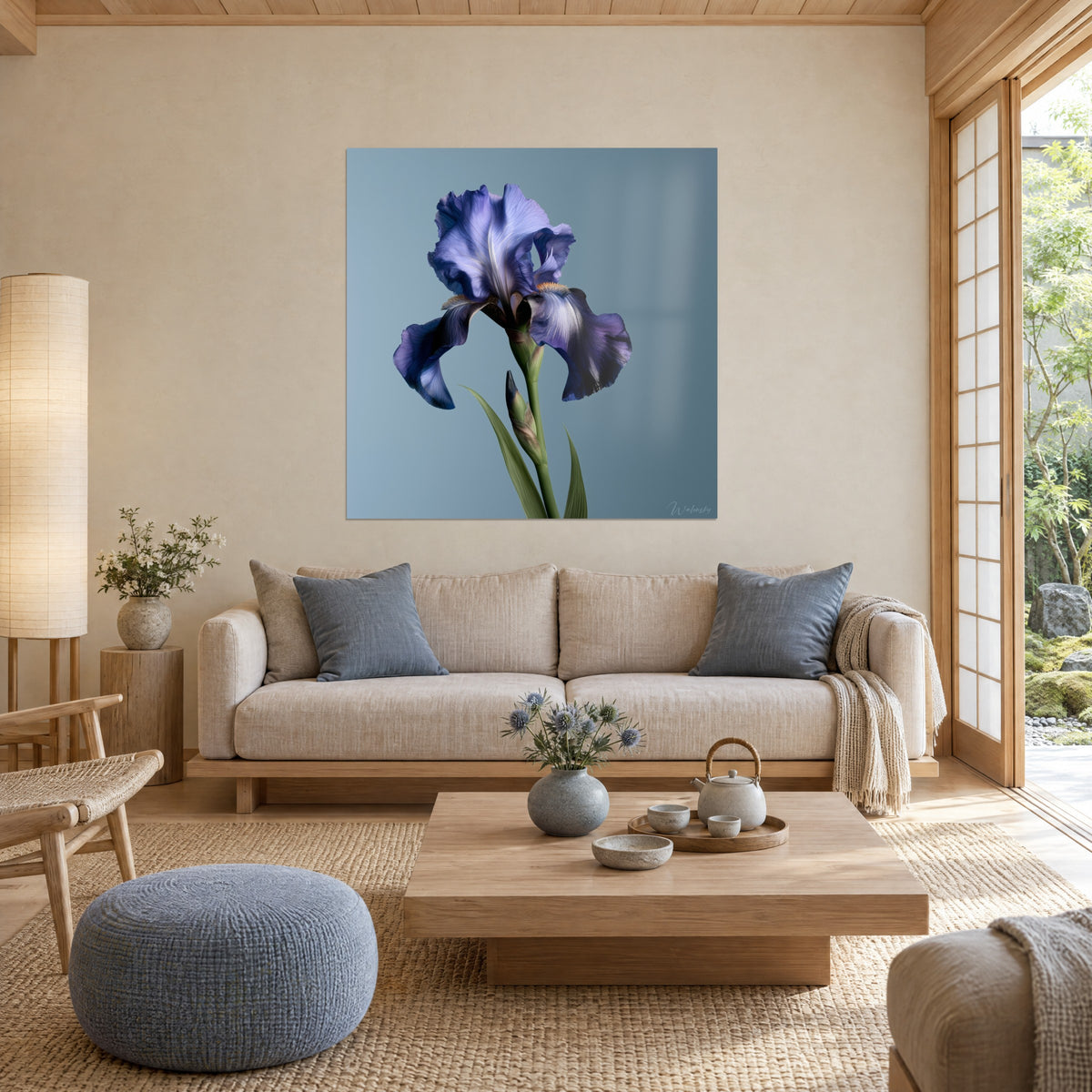 Wall art iris flower with crumpled violet petals and blue-grey reflections on a window backdrop, above a sofa in a bright living room
