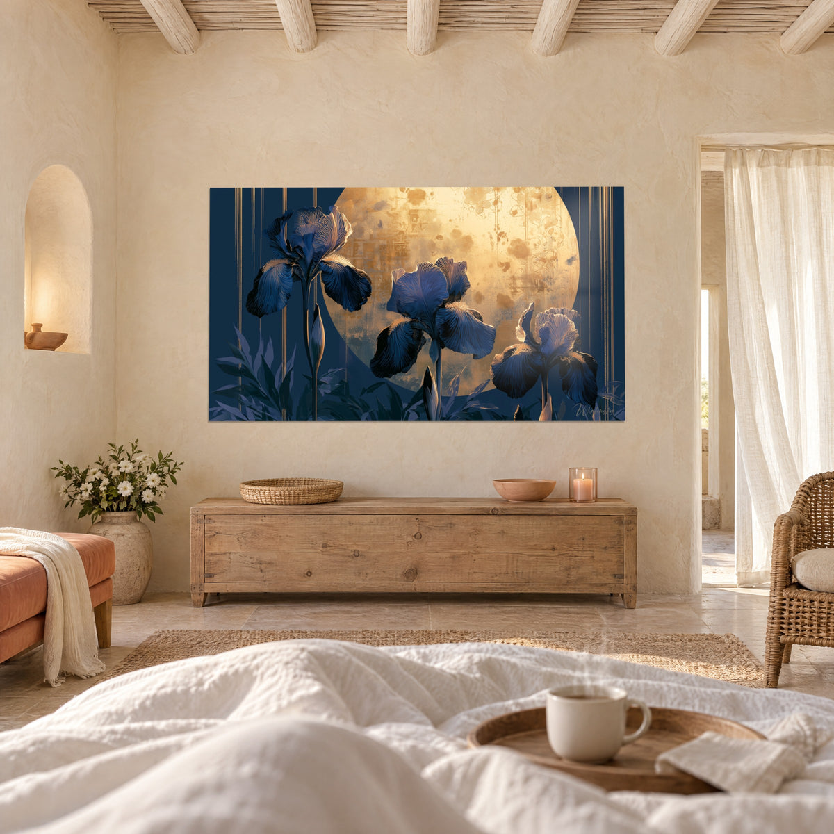 Wall art of three midnight blue irises in front of a large golden moon speckled with amber, vertical gold lines, above a bed in a bright bedroom