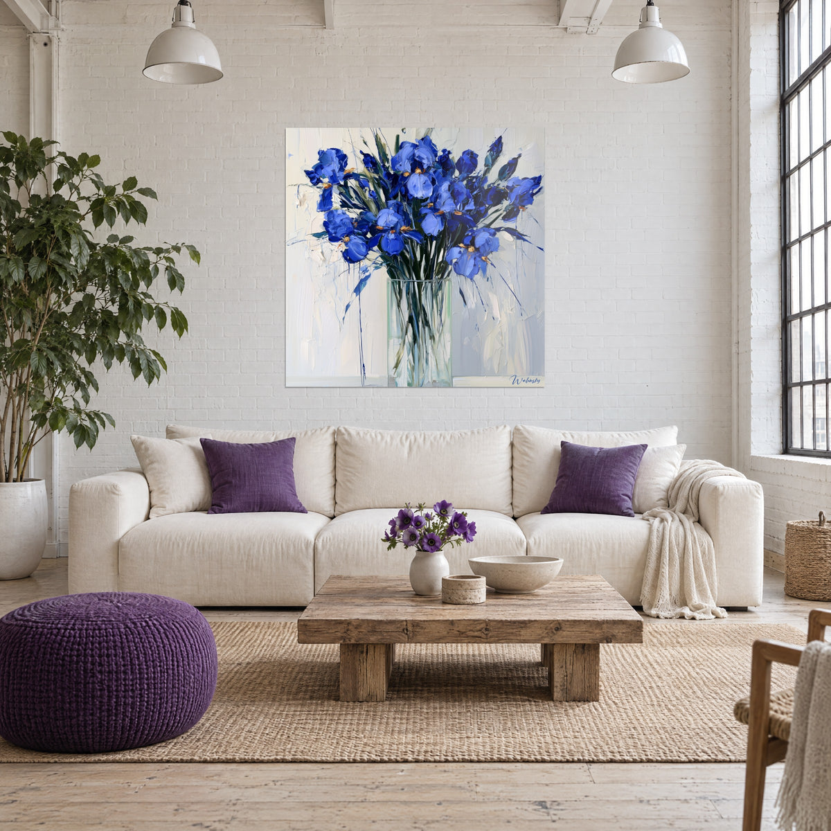 Wall art indigo iris bouquet in a glass vase, cobalt blue petals and white background, above a sofa in a bright living room