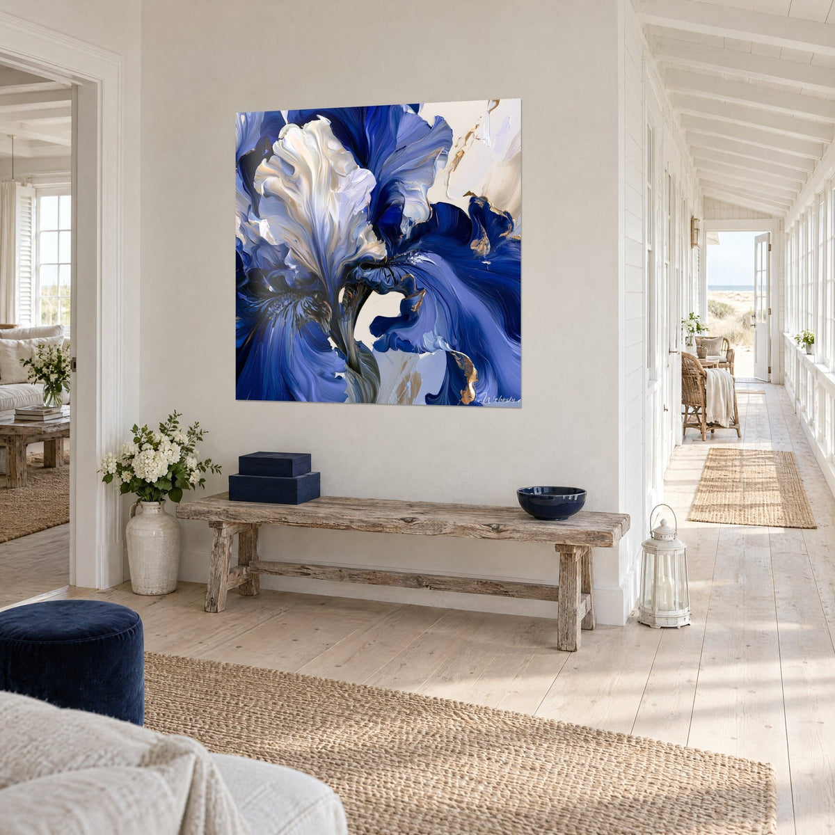 Wall art showing a palette-knife sculpted iris, swirls of cobalt blue and cream, angled view at the end of a seaside house hallway