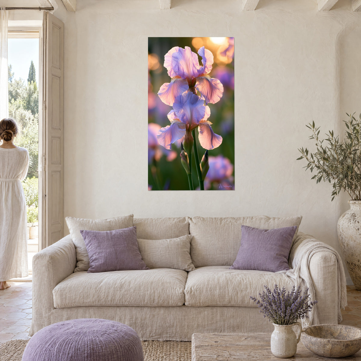 Wall art of translucent purple iris with mauve and pink petals, golden bokeh, two people seen from behind, above a sofa in a bright living room