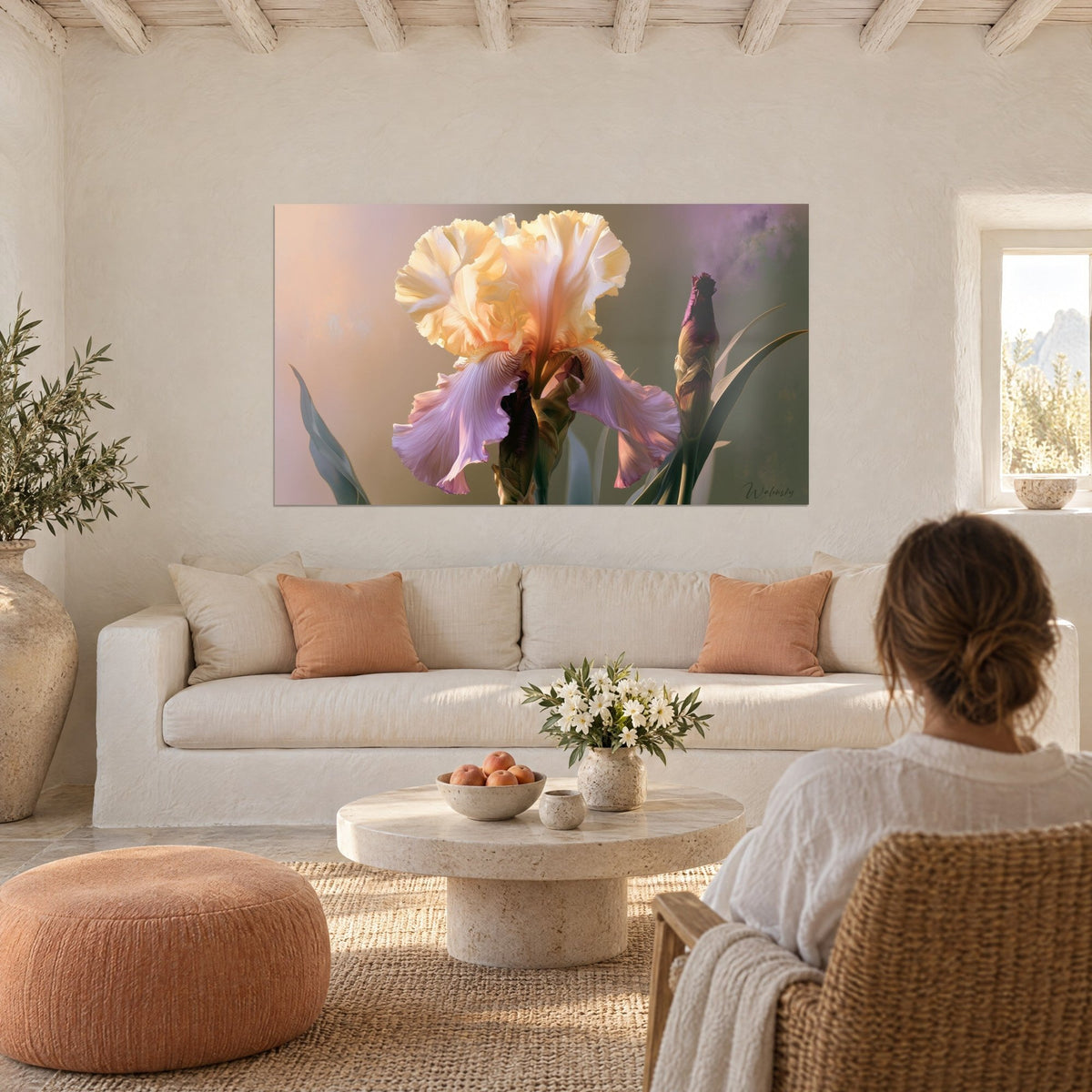Wall art cream iris with crumpled petals, mauve streaks and a purple bud, a woman seen from behind above a sofa in a bright living room