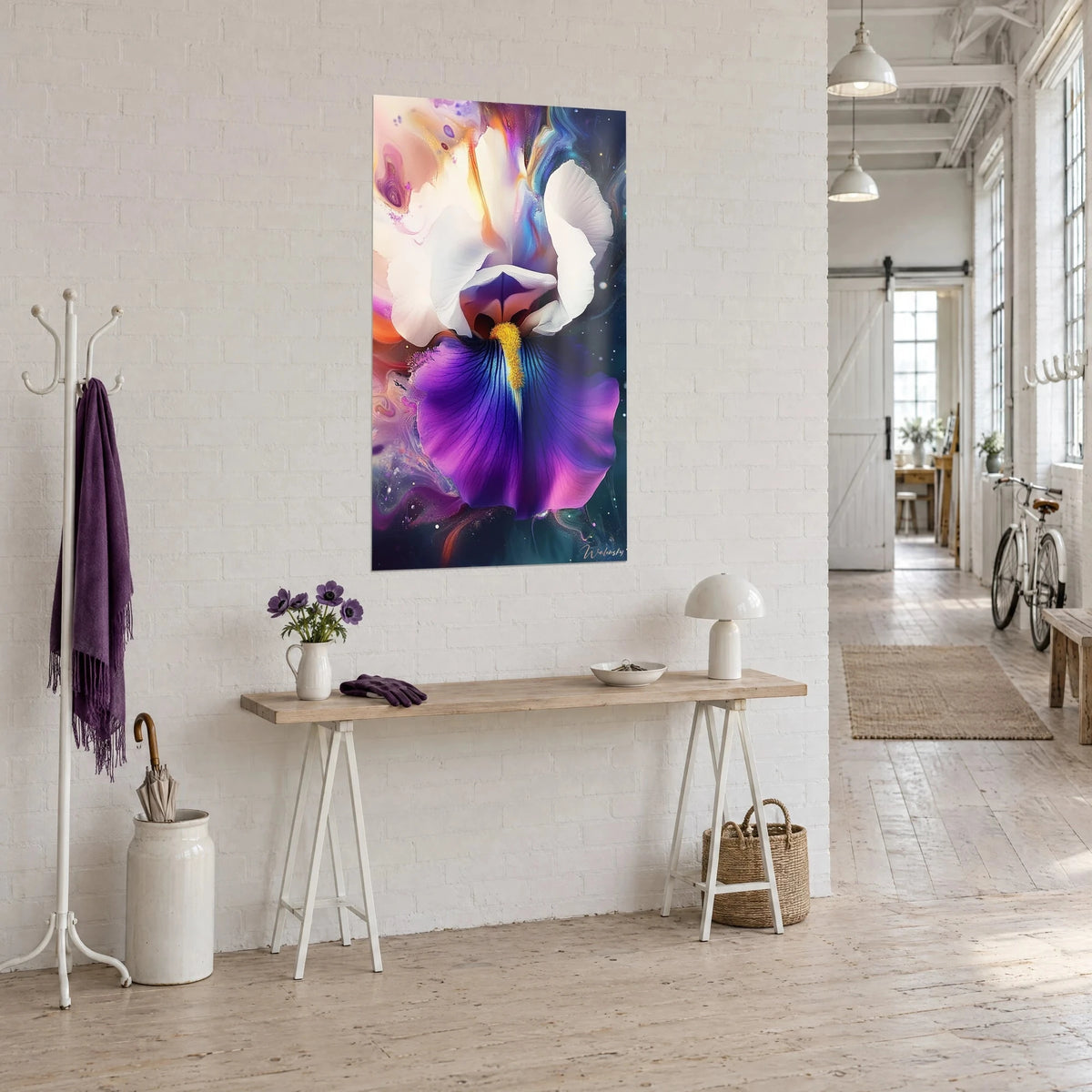 Wall art of a giant iris bloom, indigo petal veined with pink and white veils, hung beside a wooden console in an artist's loft