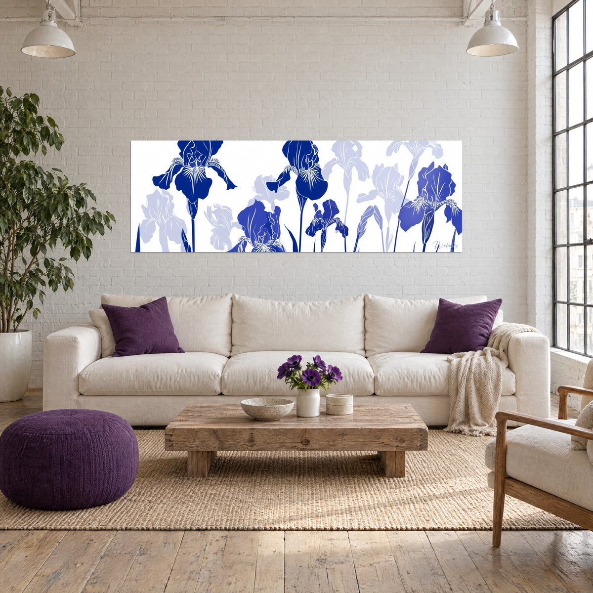 Wall art of navy bearded irises lined up on a white background, pale lavender petals, above a sofa in a bright living room