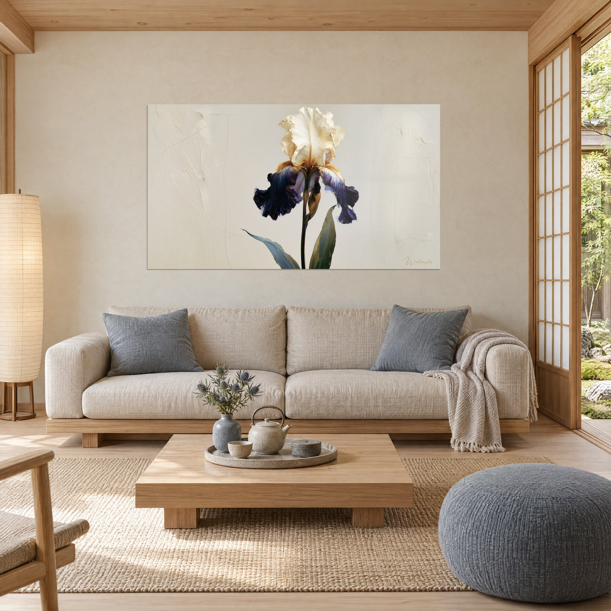 Wall art iris with cream beard and crumpled navy petals on cracked beige background, hanging above a sofa in a bright living room