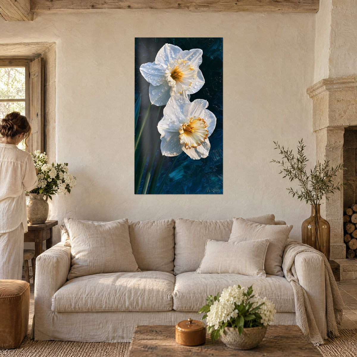 Wall art mother-of-pearl daffodils covered in droplets on a midnight blue background, golden corolla, visitor seen from behind above a sofa in a bright living room