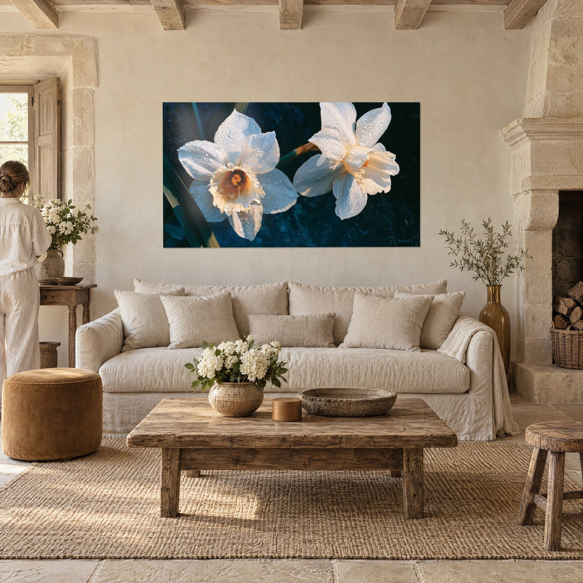Wall art white daffodils beaded with dew, orange heart on navy blue background, above a sofa in a bright living room