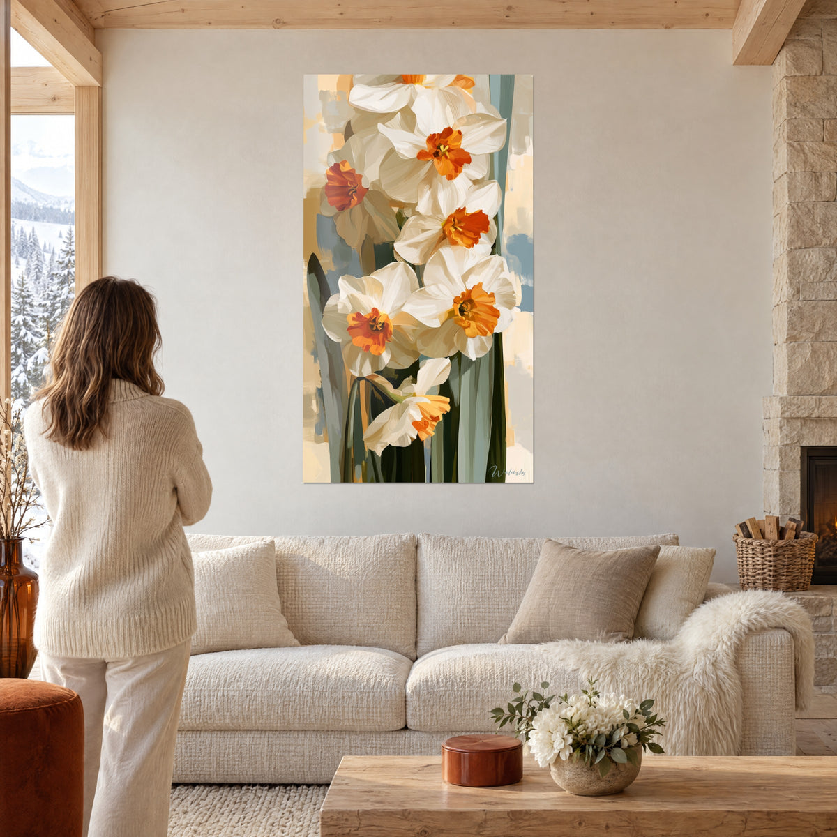 Wall art white daffodils with orange centers, ivory petals and sage green stems, above a sofa in a bright living room