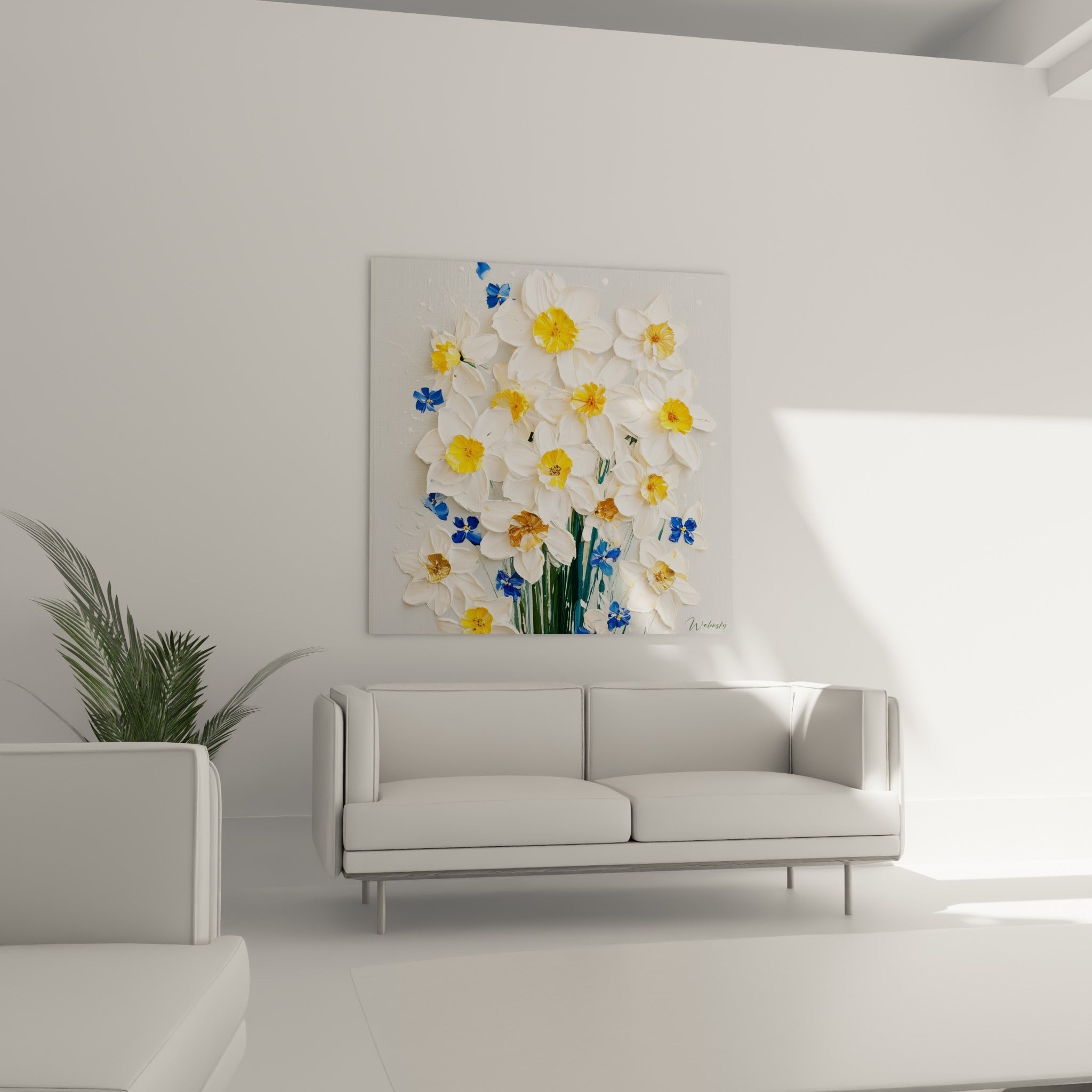 Fleurs de jonquille blanches aux touches bleu marine, disposées au-dessus d'un canapé dans un salon lumineux