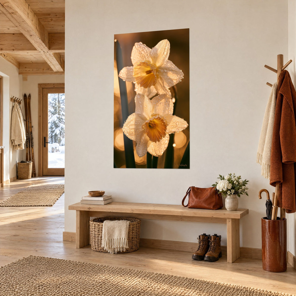 Wall art cream daffodils with a copper-orange cup, droplets on the petals, hung near a light wood bench in the entryway of a chalet