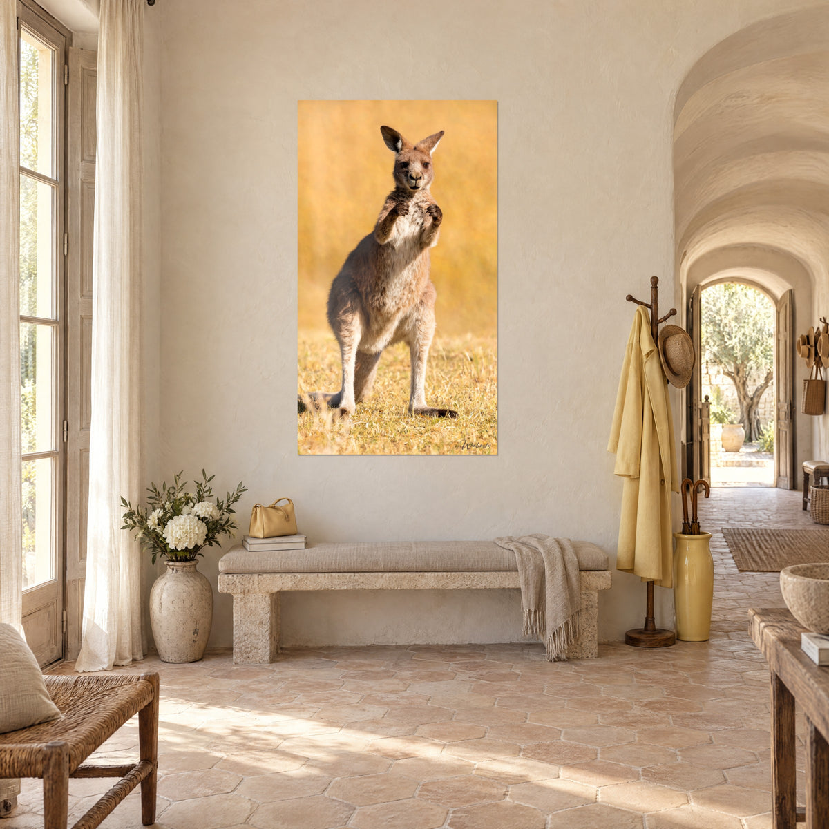 Wall art rusty-red marsupial with upright ears, beige and ochre fur, hung in a vaulted corridor of pale stone