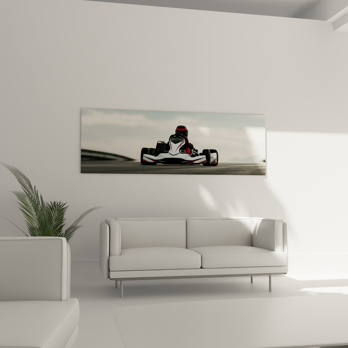 Kart blanc aux bandes rouges lancé sur circuit gris, au-dessus d'un canapé dans un salon lumineux