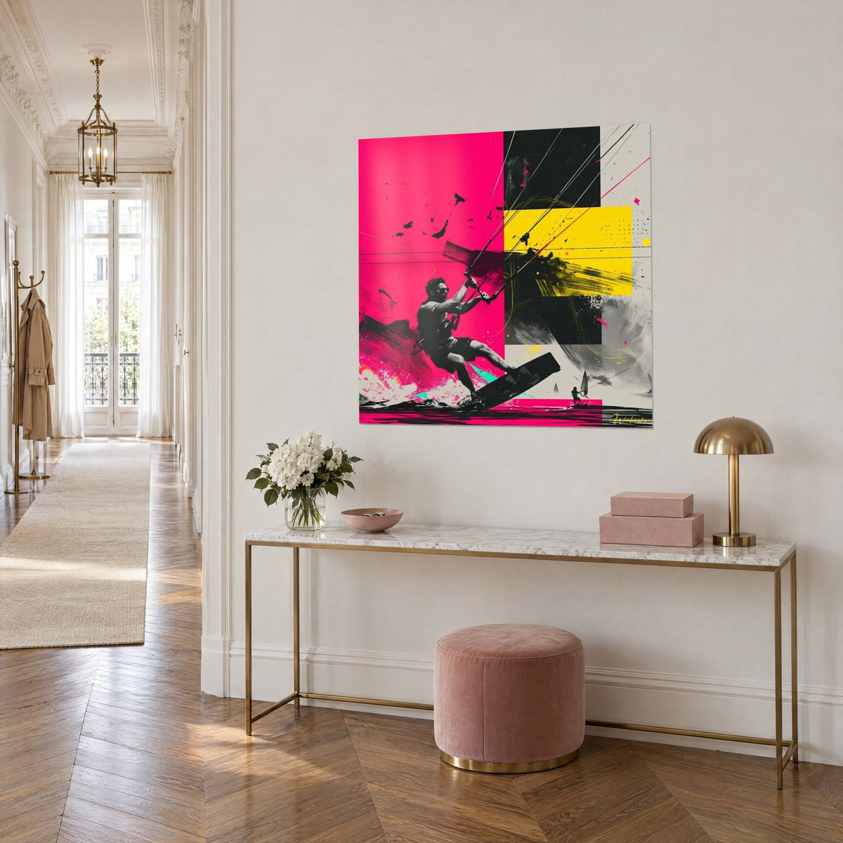 Sports wall art of a rider mid-jump on a black board, flat areas of fuchsia, bright yellow and black, hung above a gold console in the entrance hall
