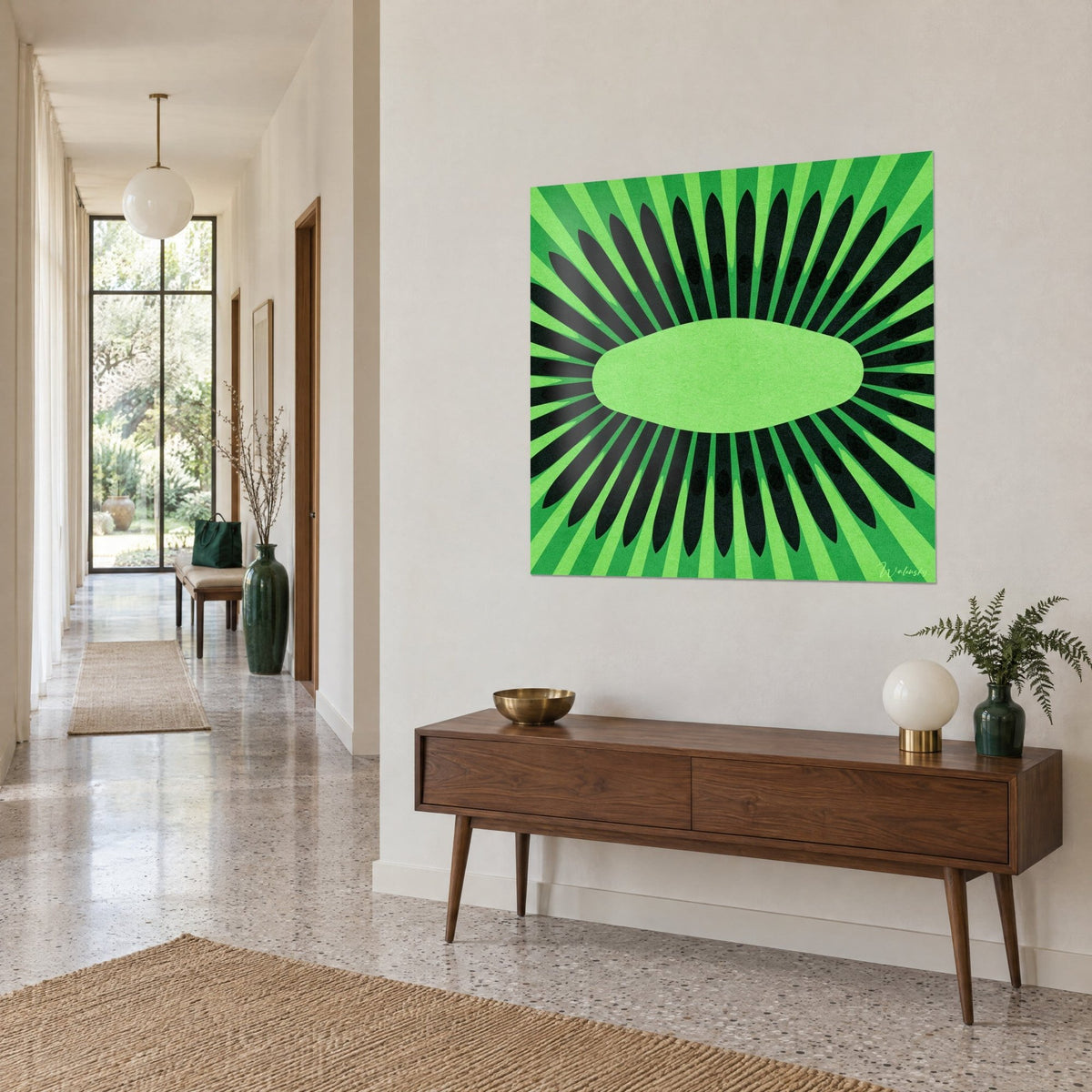 Wall art exotic fruit sliced, black and green rays around an apple-green ellipse, beige hallway wall, wooden console table