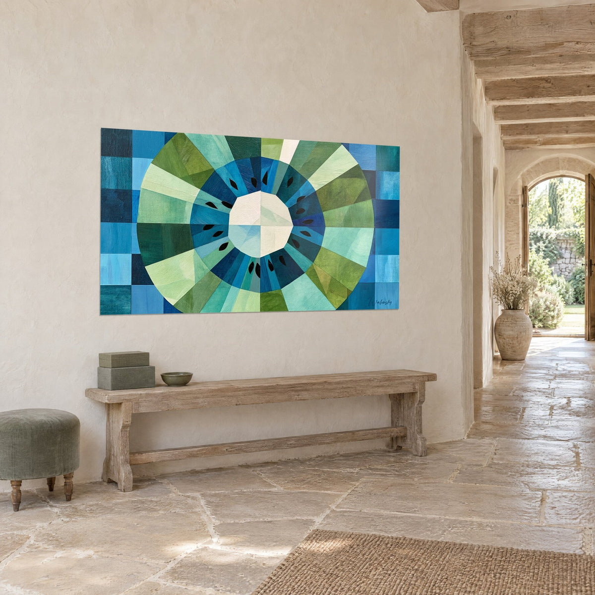 Wall art sliced fruit in an olive green and navy blue circle, ivory core, turquoise checkerboard, hallway with pale stone walls