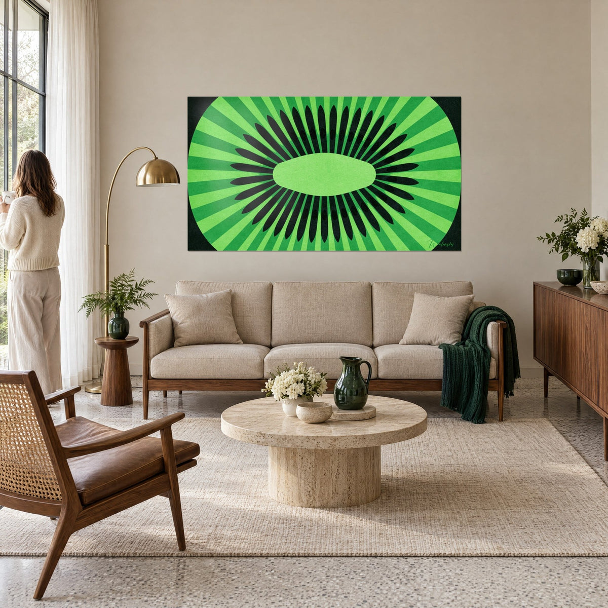 Wall art stylized kiwi slice with apple-green and black rays, hung above a sofa in a bright living room