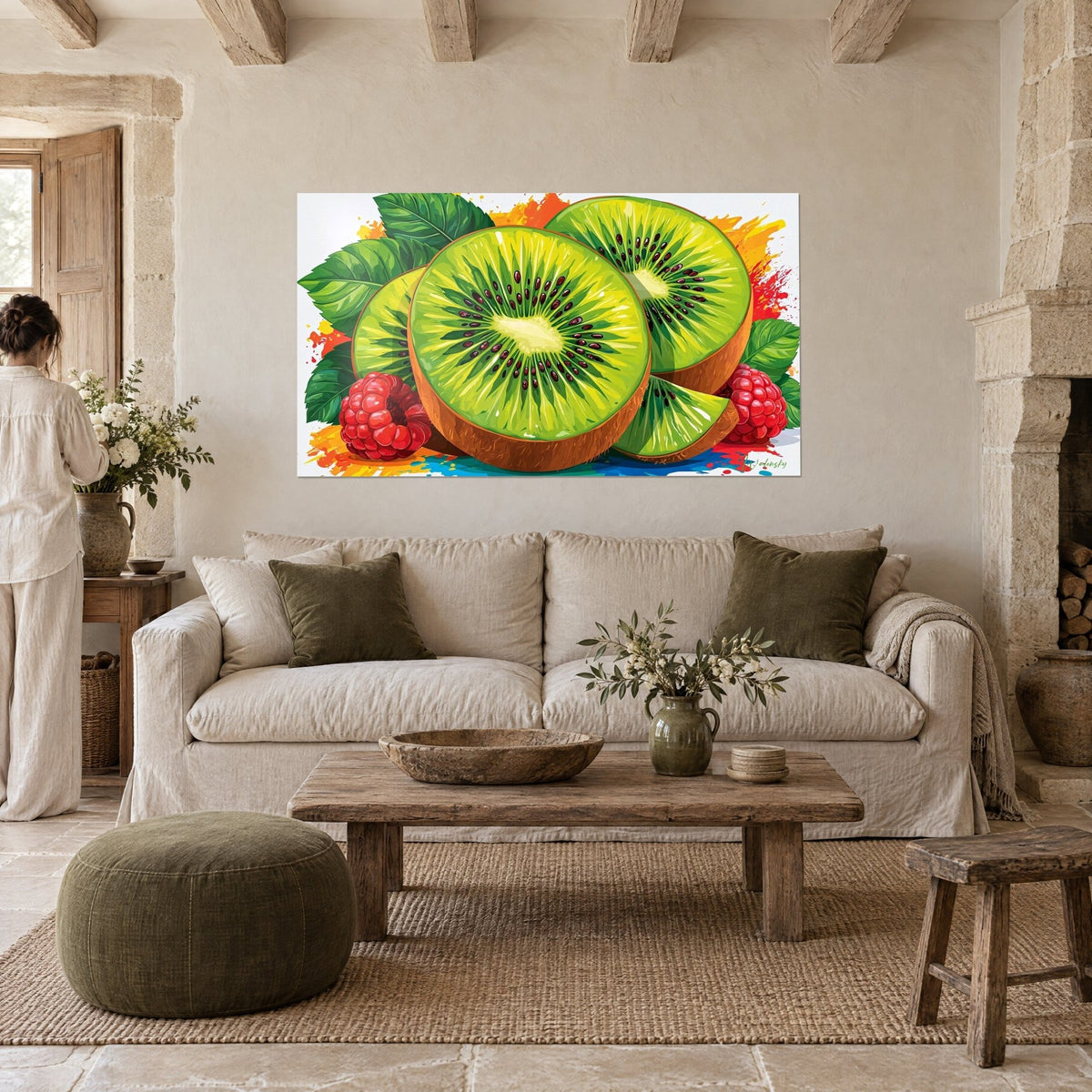 Wall art sliced kiwi in lime green with black seeds, red raspberries and orange splashes, in front of a couple seen from behind, above a sofa in a bright living room