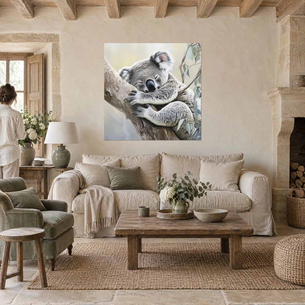 Wall art of a sleeping koala hugging a eucalyptus branch, grey and cream fur, verdigris leaves, above a sofa in a bright living room
