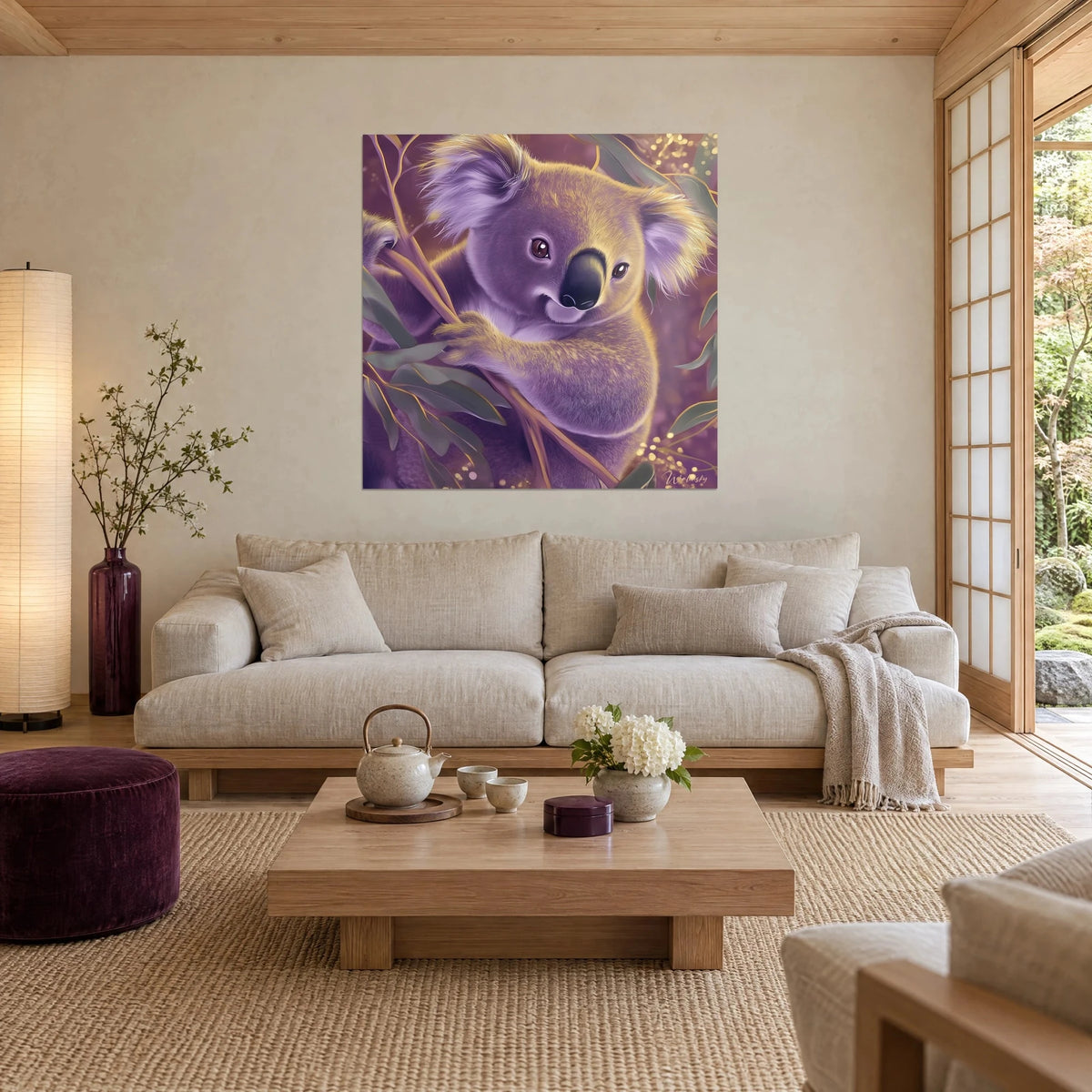 Wall art lilac koala with golden ears, perched among grey-green eucalyptus leaves, hanging above a sofa in a bright living room