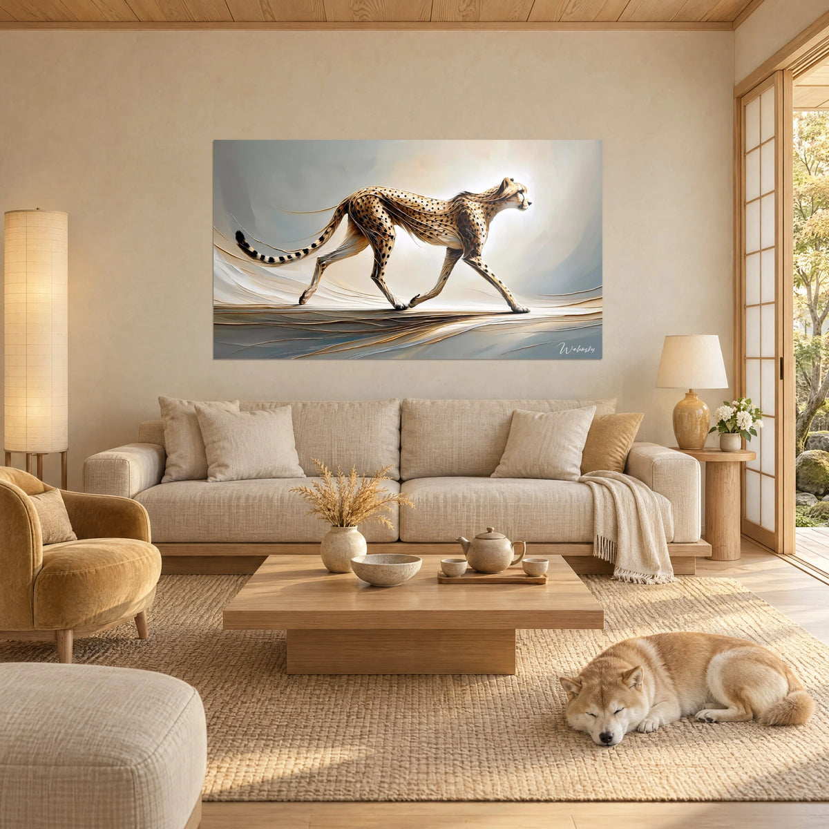Wall art of a cheetah in a stretched stride, sand-colored coat speckled with black on a pearl grey background, above a sofa in a bright living room
