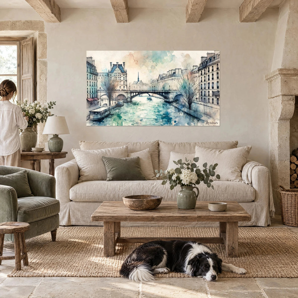 Wall art Seine in turquoise and ochre watercolour, arched bridge and slate rooftops, lying collie, above a sofa in a bright living room